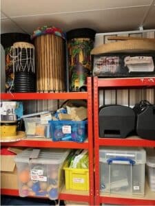shelving stacked with musical instruments